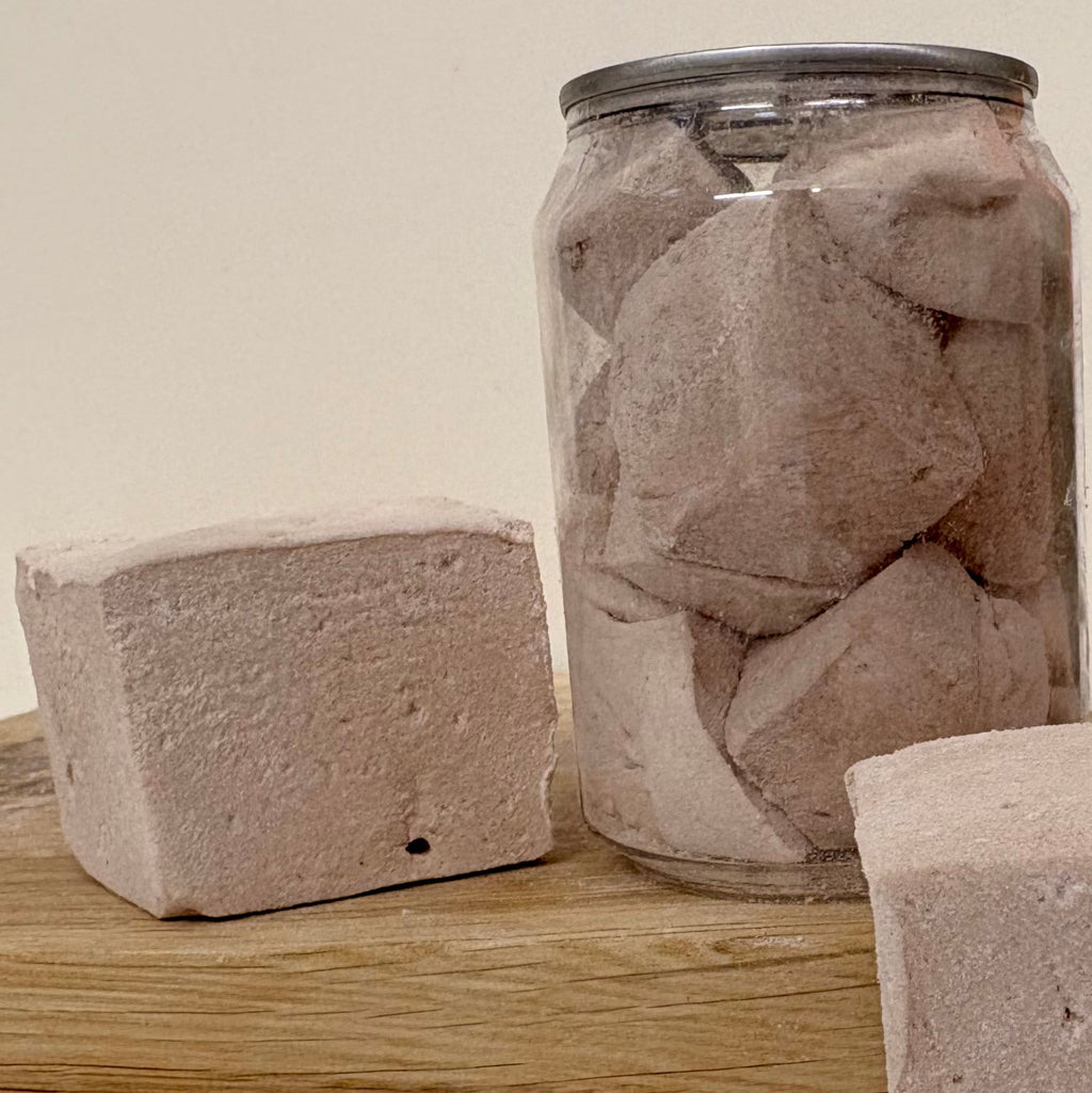 Can  filled with Scousemallows on a wooden surface